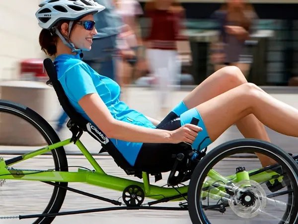 Rider on a lime-green Catrike demo trike